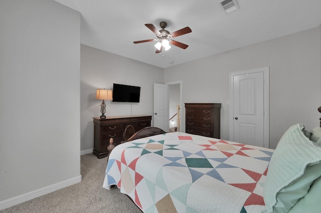 bedroom with visible vents, carpet flooring, baseboards, and ceiling fan