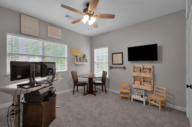 office featuring visible vents, carpet, ceiling fan, and baseboards