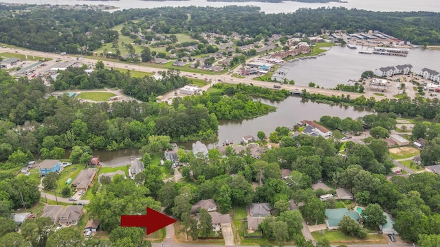 drone / aerial view with a residential view and a water view