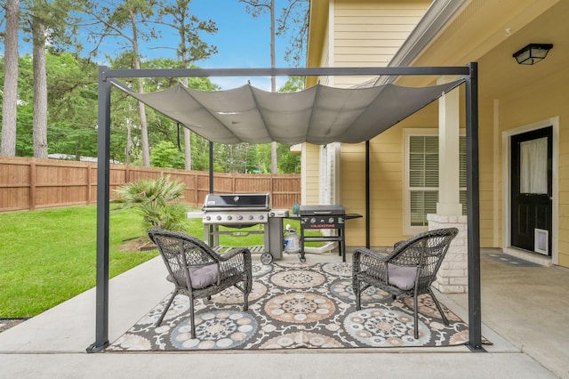 view of patio with fence and area for grilling