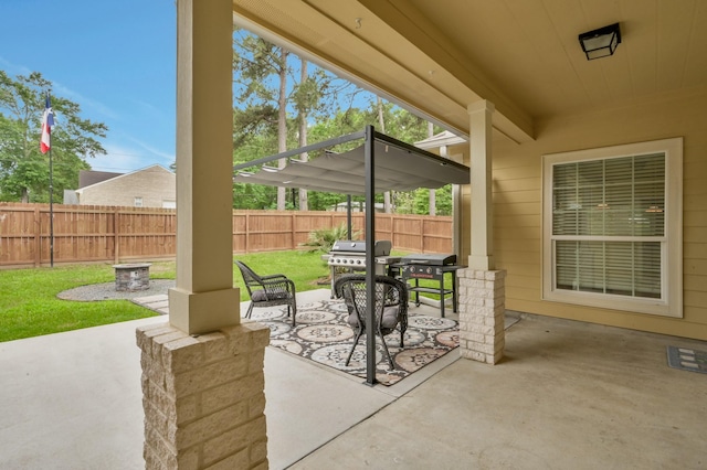 view of patio featuring grilling area, outdoor dining space, and a fenced backyard
