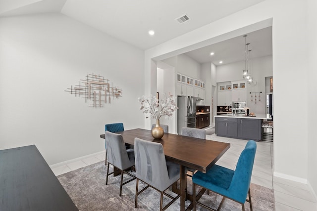 dining space featuring light tile patterned floors, baseboards, recessed lighting, and visible vents