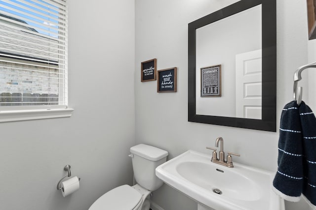 bathroom with a sink and toilet