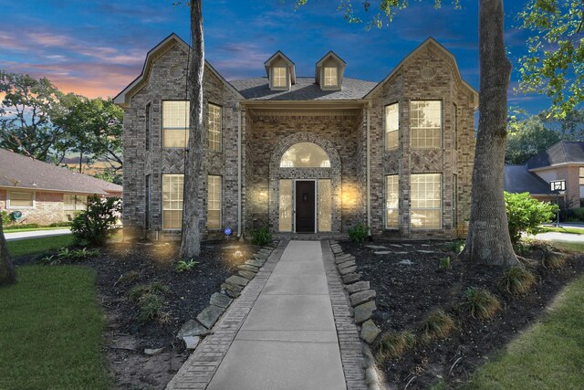 view of front of property featuring brick siding