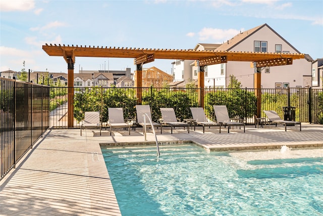 community pool featuring a patio area, fence, and a pergola