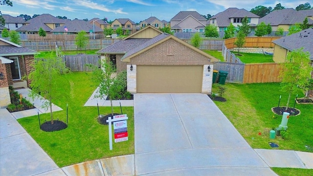 view of front facade featuring a garage, a front lawn, fence, driveway, and a residential view