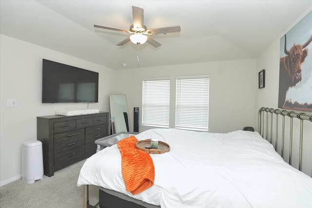 bedroom with ceiling fan and light carpet