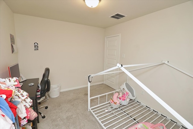 carpeted bedroom featuring visible vents and baseboards