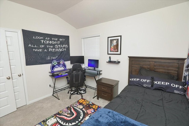 bedroom with baseboards, lofted ceiling, and carpet