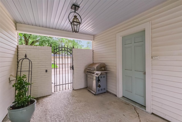 view of patio with a gate and grilling area