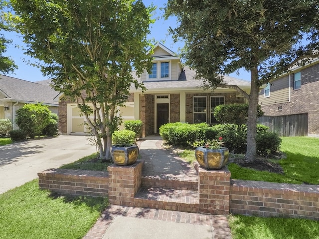 obstructed view of property with driveway and brick siding