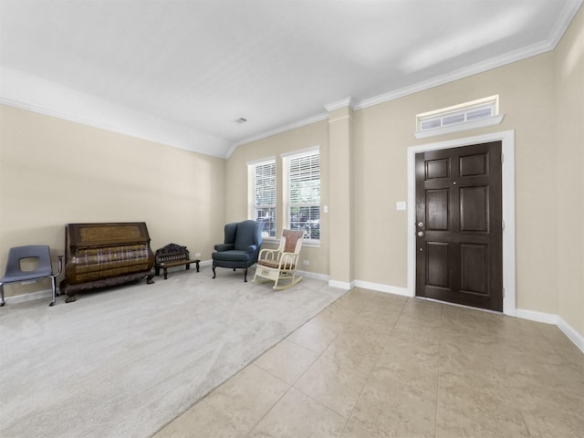 living area with tile patterned flooring, ornamental molding, and baseboards