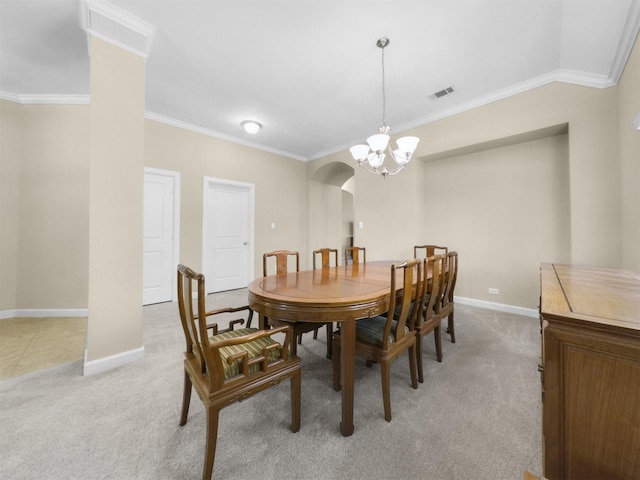 18223 E Willow Oak Bend Dr, Cypress, TX 77433 - dining room featuring light colored carpet, crown molding, visible vents, and arched walkways