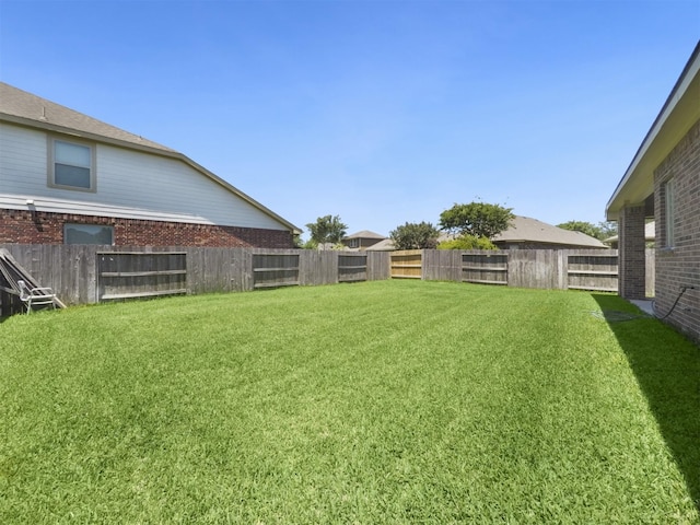view of yard featuring a fenced backyard