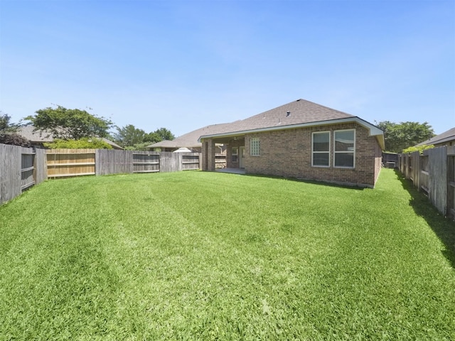 view of yard featuring a fenced backyard