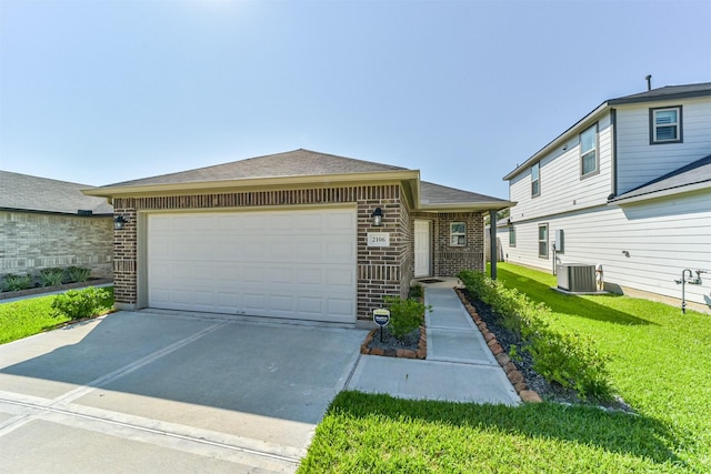 view of front of home featuring a front yard, brick siding, concrete driveway, an attached garage, and a shingled roof
