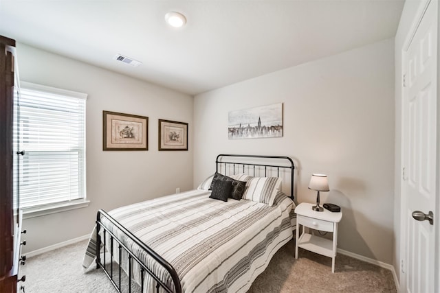 bedroom featuring carpet floors, baseboards, and visible vents