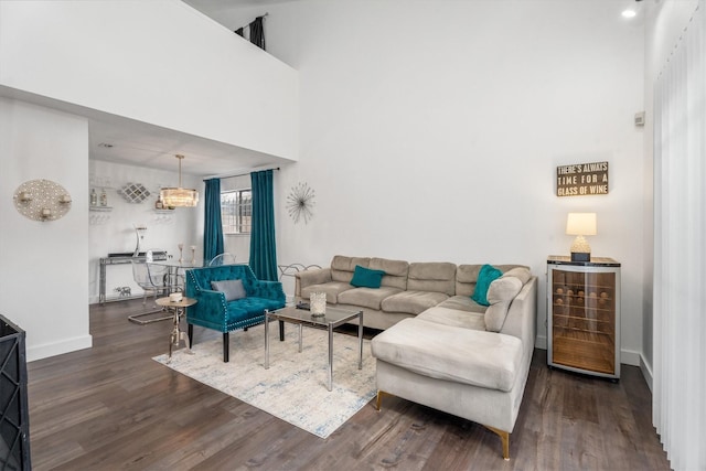 9502 Windswept Ln Unit 9502, Houston, TX 77063 - living room with beverage cooler, baseboards, a towering ceiling, and wood finished floors