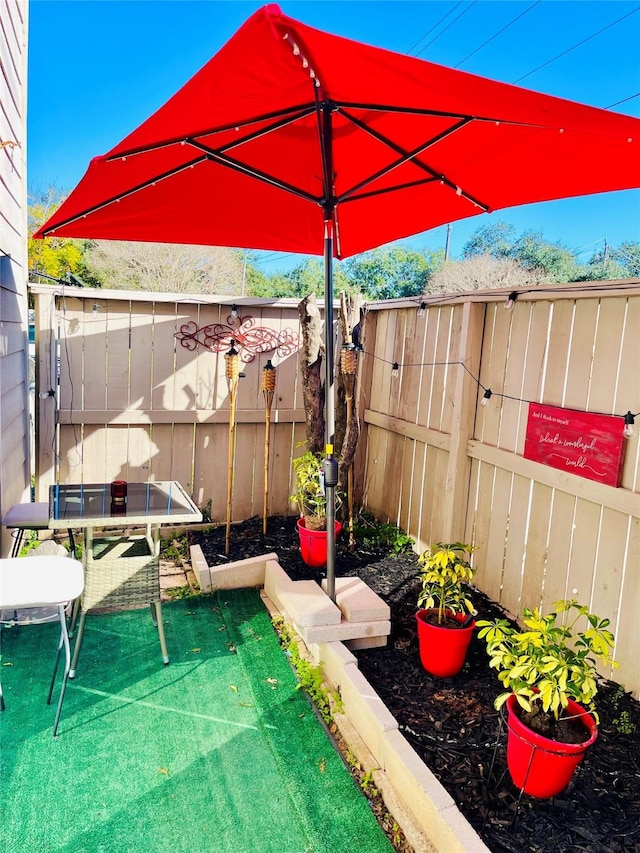 9502 Windswept Ln Unit 9502, Houston, TX 77063 - view of patio / terrace featuring a fenced backyard