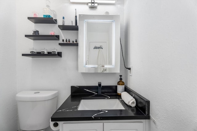9502 Windswept Ln Unit 9502, Houston, TX 77063 - half bathroom featuring vanity and toilet