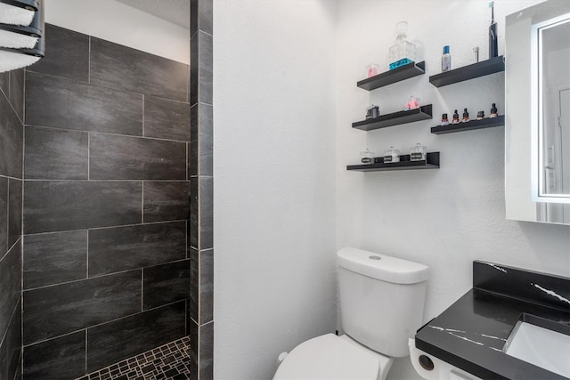 9502 Windswept Ln Unit 9502, Houston, TX 77063 - full bathroom featuring toilet, tiled shower, and vanity