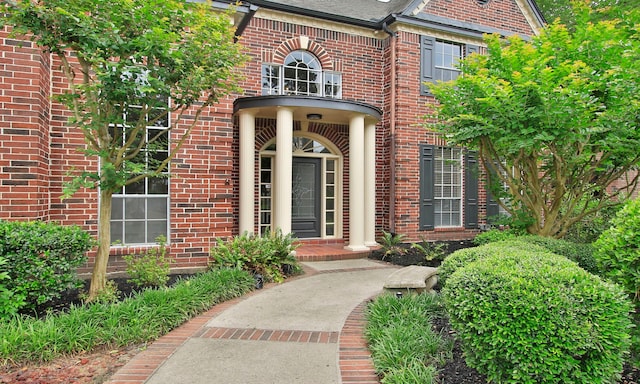 7711 Oxfordshire Dr, Spring, TX 77379 - doorway to property featuring brick siding