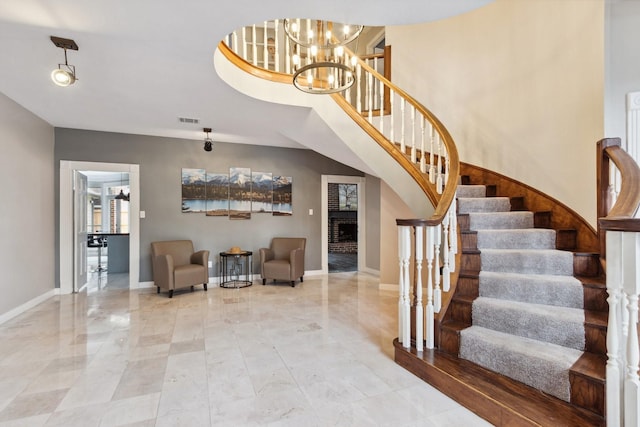 7711 Oxfordshire Dr, Spring, TX 77379 - stairway with a notable chandelier, baseboards, and visible vents