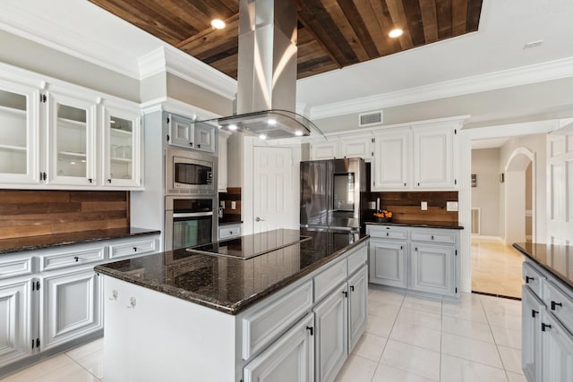 7711 Oxfordshire Dr, Spring, TX 77379 - kitchen with island exhaust hood, visible vents, tasteful backsplash, wooden ceiling, and stainless steel appliances