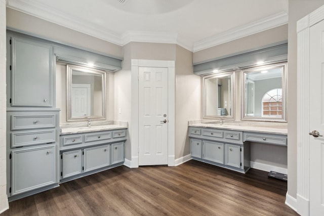7711 Oxfordshire Dr, Spring, TX 77379 - full bathroom with crown molding, baseboards, wood finished floors, and two vanities