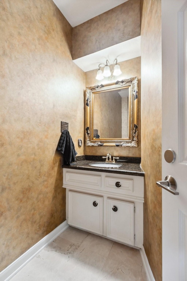 7711 Oxfordshire Dr, Spring, TX 77379 - bathroom featuring baseboards and vanity