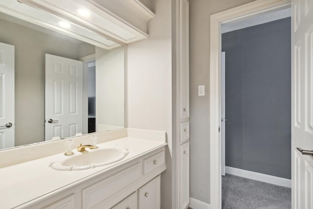 7711 Oxfordshire Dr, Spring, TX 77379 - bathroom with baseboards and vanity