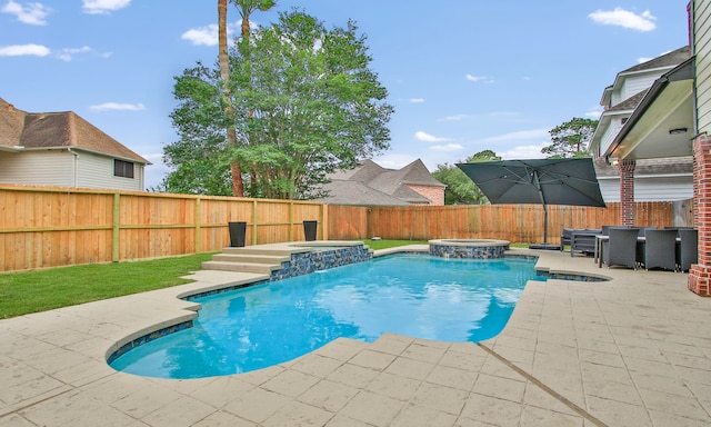 7711 Oxfordshire Dr, Spring, TX 77379 - view of swimming pool featuring a fenced backyard, a patio, and a pool with connected hot tub