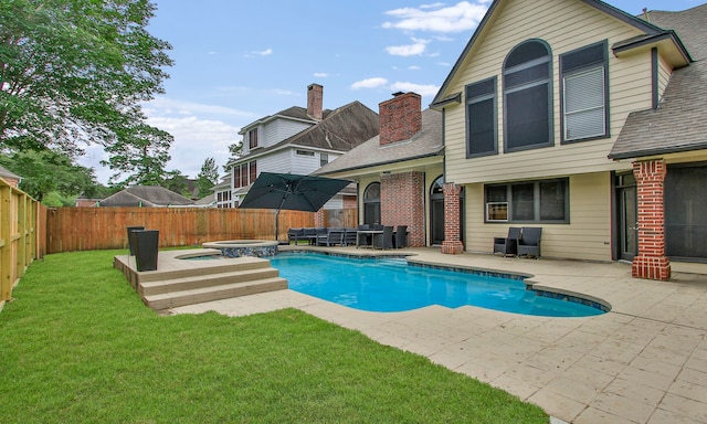 7711 Oxfordshire Dr, Spring, TX 77379 - view of swimming pool with a fenced backyard, a patio area, a pool with connected hot tub, and a yard