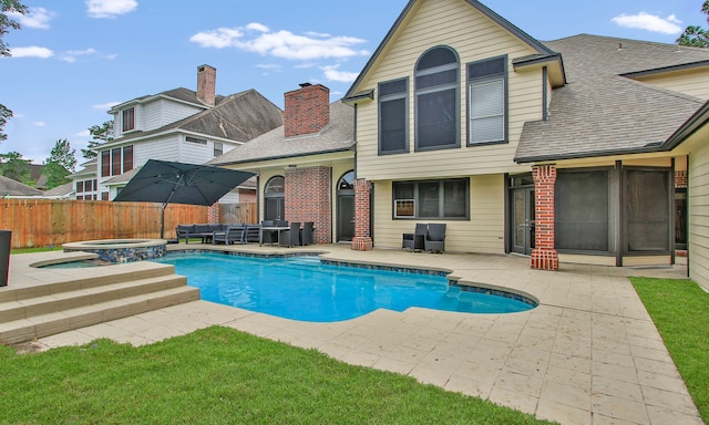 7711 Oxfordshire Dr, Spring, TX 77379 - view of swimming pool with a patio, an outdoor living space, fence, and a pool with connected hot tub
