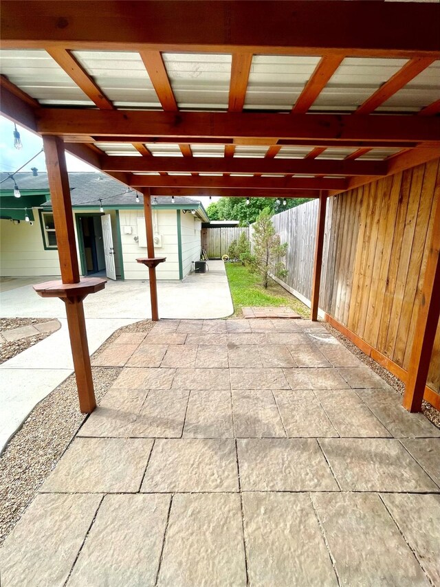 view of patio featuring an outbuilding and a fenced backyard