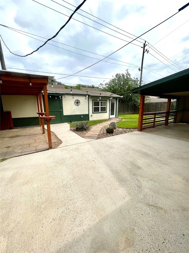 single story home featuring fence