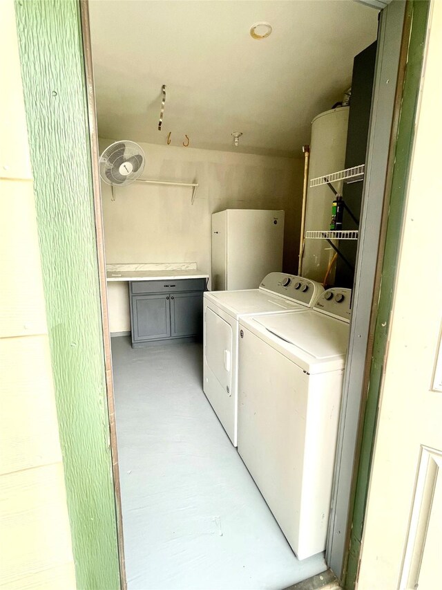 clothes washing area featuring laundry area and washer and dryer