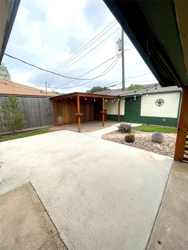 exterior space with a patio and fence