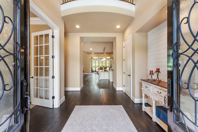 foyer entrance featuring recessed lighting, baseboards, and wood finished floors