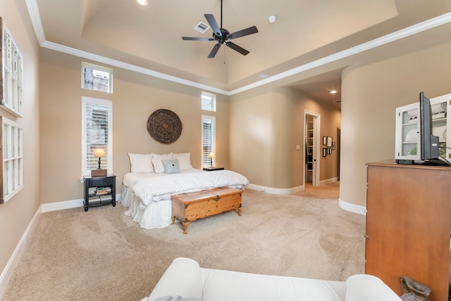 bedroom with baseboards, carpet, and a raised ceiling