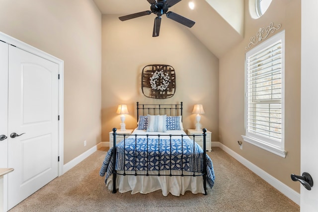bedroom featuring carpet floors, a ceiling fan, baseboards, and lofted ceiling