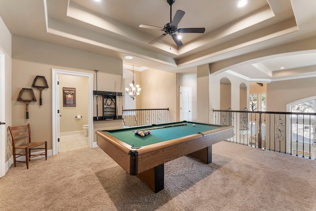 game room with light colored carpet, recessed lighting, a raised ceiling, and ceiling fan with notable chandelier