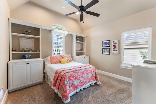 bedroom with carpet flooring, a ceiling fan, baseboards, and lofted ceiling