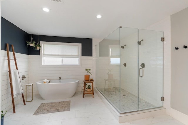 full bathroom featuring recessed lighting, marble finish floor, a stall shower, and a soaking tub