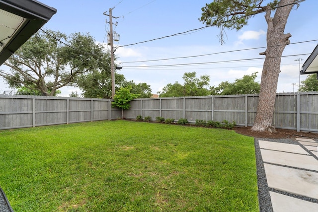 view of yard with a fenced backyard