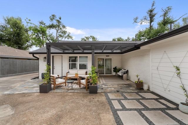 back of property featuring fence, outdoor lounge area, and a patio area