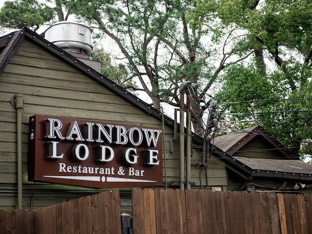 community sign featuring fence