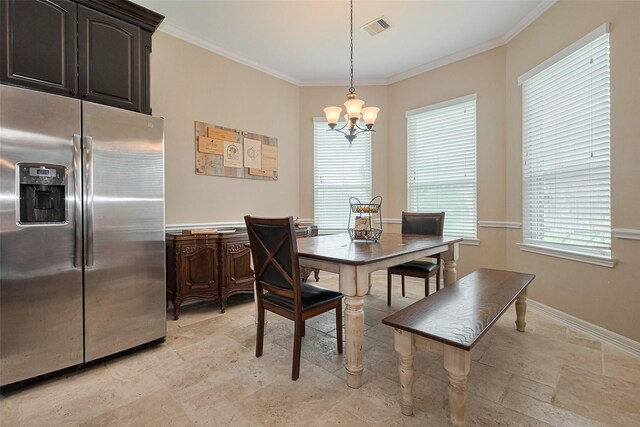 dining space with crown molding, a wealth of natural light, a notable chandelier, and visible vents