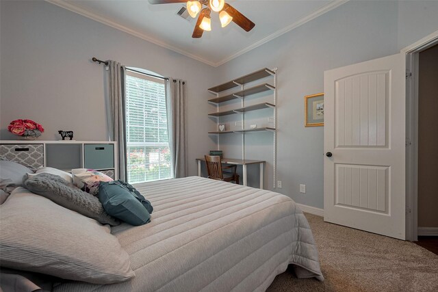 carpeted bedroom with a ceiling fan, baseboards, multiple windows, and ornamental molding