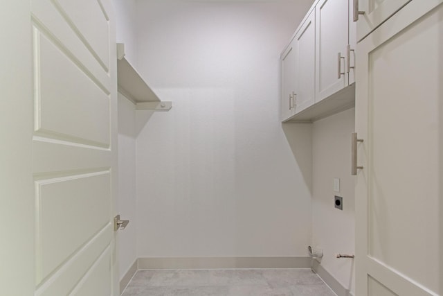 79 Rd 6606, Dayton, TX 77535 - laundry room with electric dryer hookup, baseboards, and cabinet space